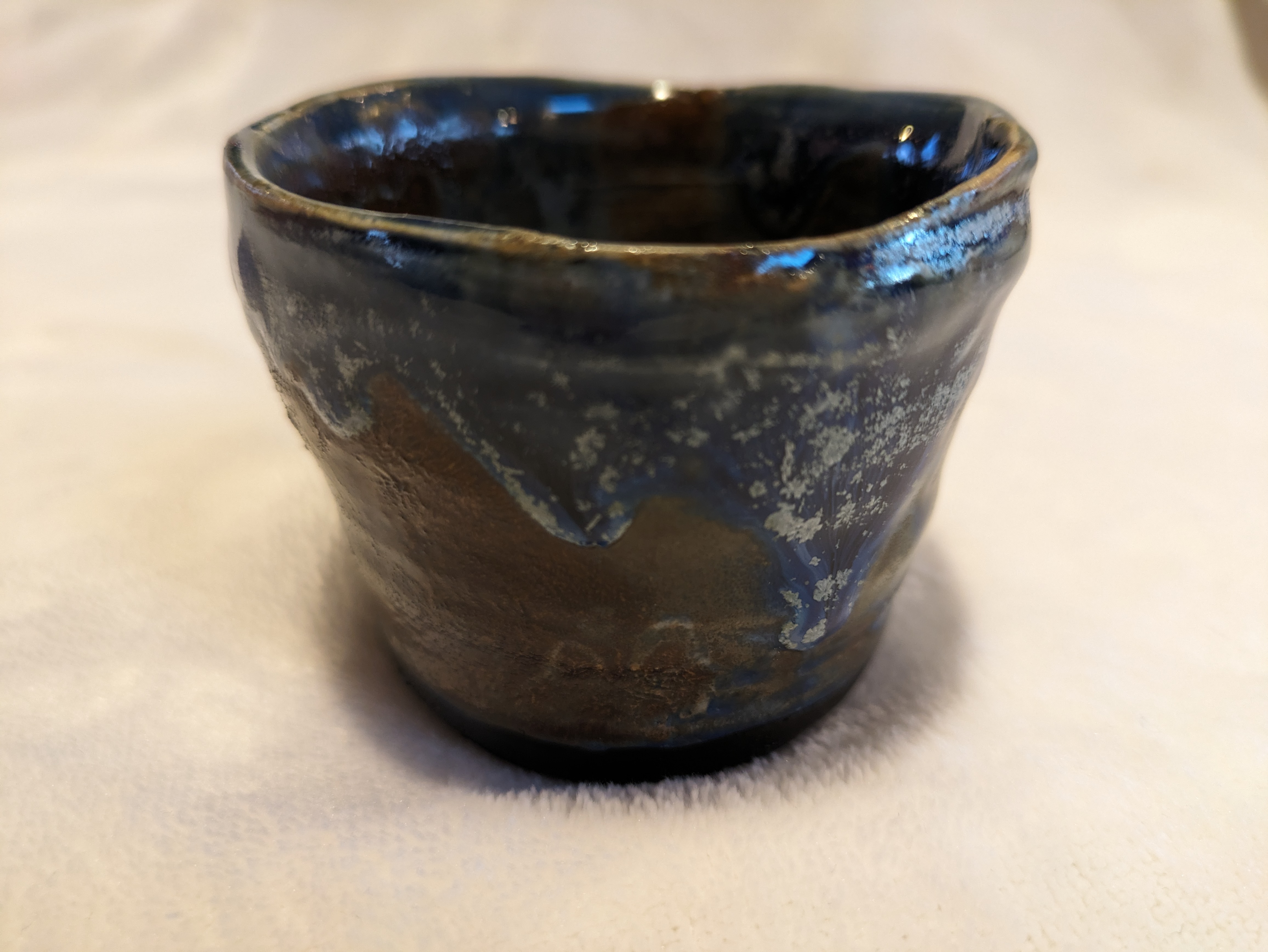 Blue and bronze teacup